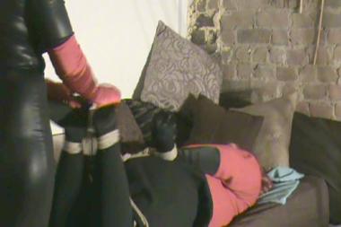 Gillian Hogtied And Tickled - Mistress sharon has invited gillian to go out dancing with her. They discuss the plans and then mistress sharon fixes gillian's lipstick. After getting her relaxed she ties her up in a hogtie and then starts tickling her feet with her red satin gloves. Mistress sharon wearing a catsuit, long red satin gloves and shiny otk boots tickles gillian relentlesly. Gillian begs her to stop. She also spanks her before finally untying her.